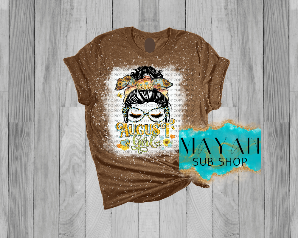 August girl messy bun in heather brown bleached shirt. -Mayan Sub Shop