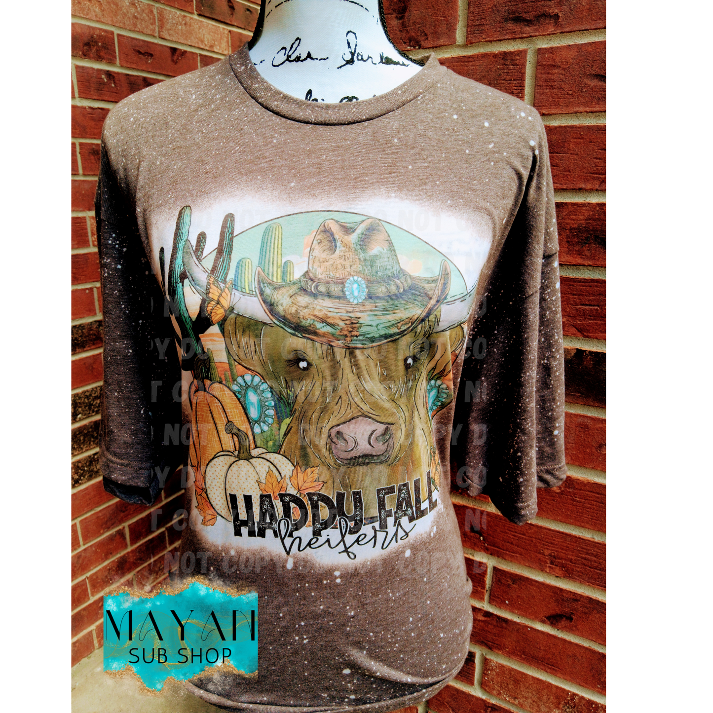 Happy fall heifers in heather brown bleached shirt. -Mayan Sub Shop