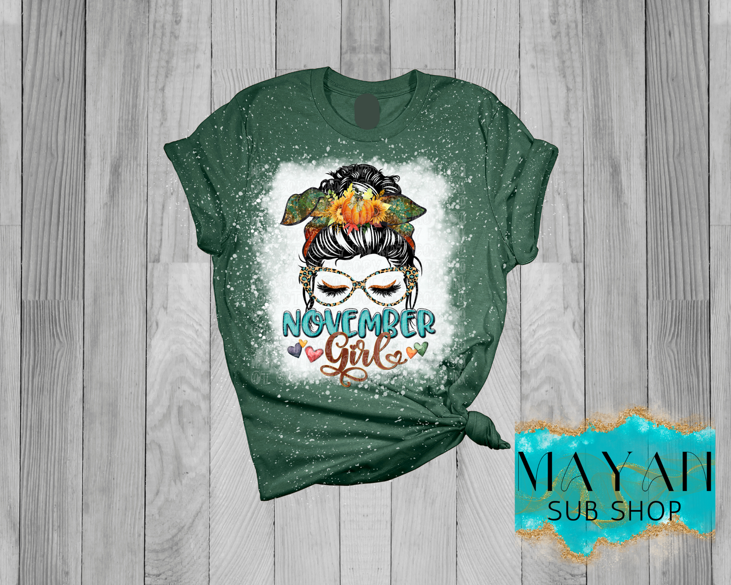 November girl messy bun in heather forest green bleached shirt. -Mayan Sub Shop