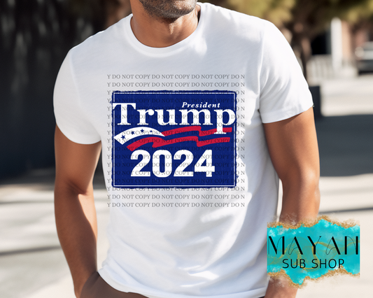 Trump 2024 blue in white shirt. -Mayan Sub Shop