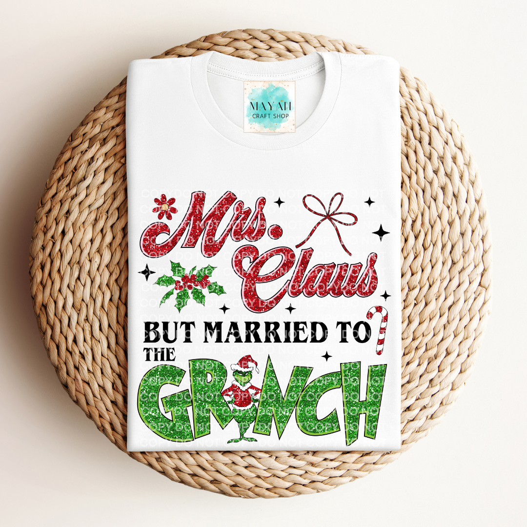 Mrs. Claus married to grinch white shirt. -Mayan Craft Shop